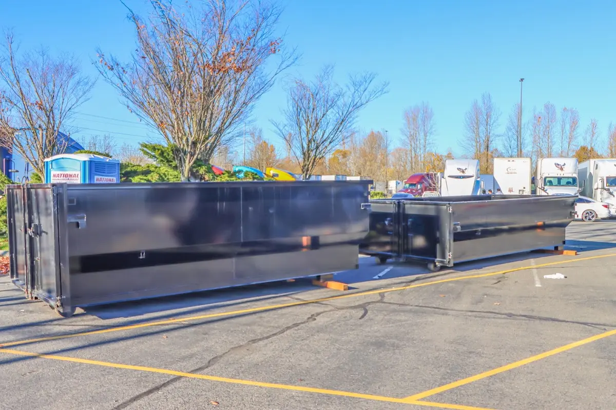 Professional dumpster rental service with roll-off container on residential driveway in Allendale